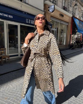 Woman in leopard jacket and jeans.