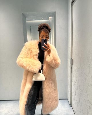 French woman wearing a fur coat