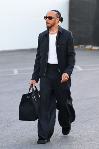 LAS VEGAS, NEVADA - NOVEMBER 20: Lewis Hamilton of Great Britain and Mercedes walks in the Paddock during previews ahead of the F1 Grand Prix of Las Vegas at Las Vegas Strip Circuit on November 20, 2024 in Las Vegas, Nevada.