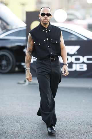 LAS VEGAS, NEVADA - NOVEMBER 21: Lewis Hamilton of Great Britain and Mercedes walks in the Paddock prior to practice ahead of the F1 Grand Prix of Las Vegas at Las Vegas Strip Circuit on November 21, 2024 in Las Vegas, Nevada.