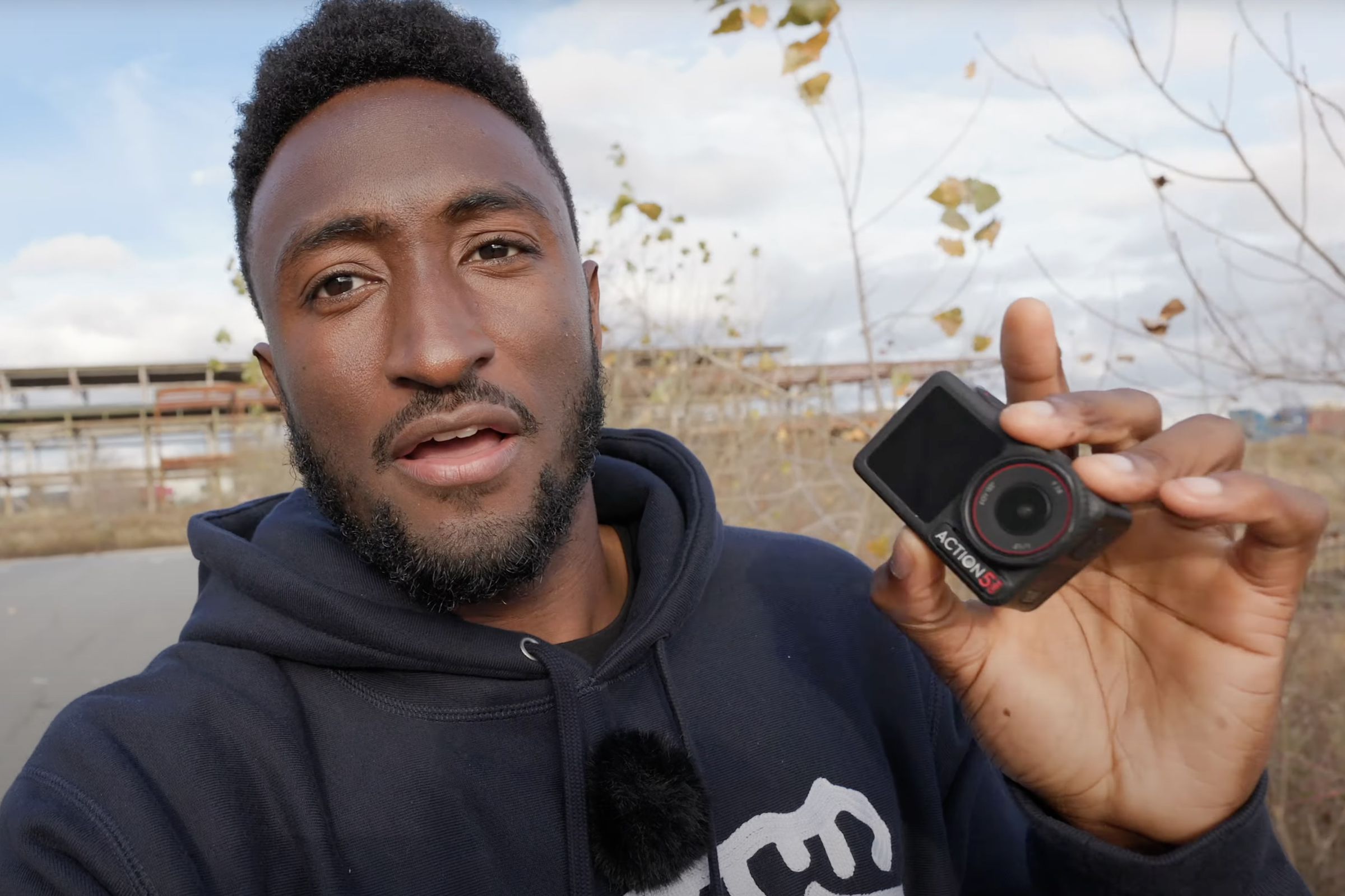 MKBHD holding an action camera