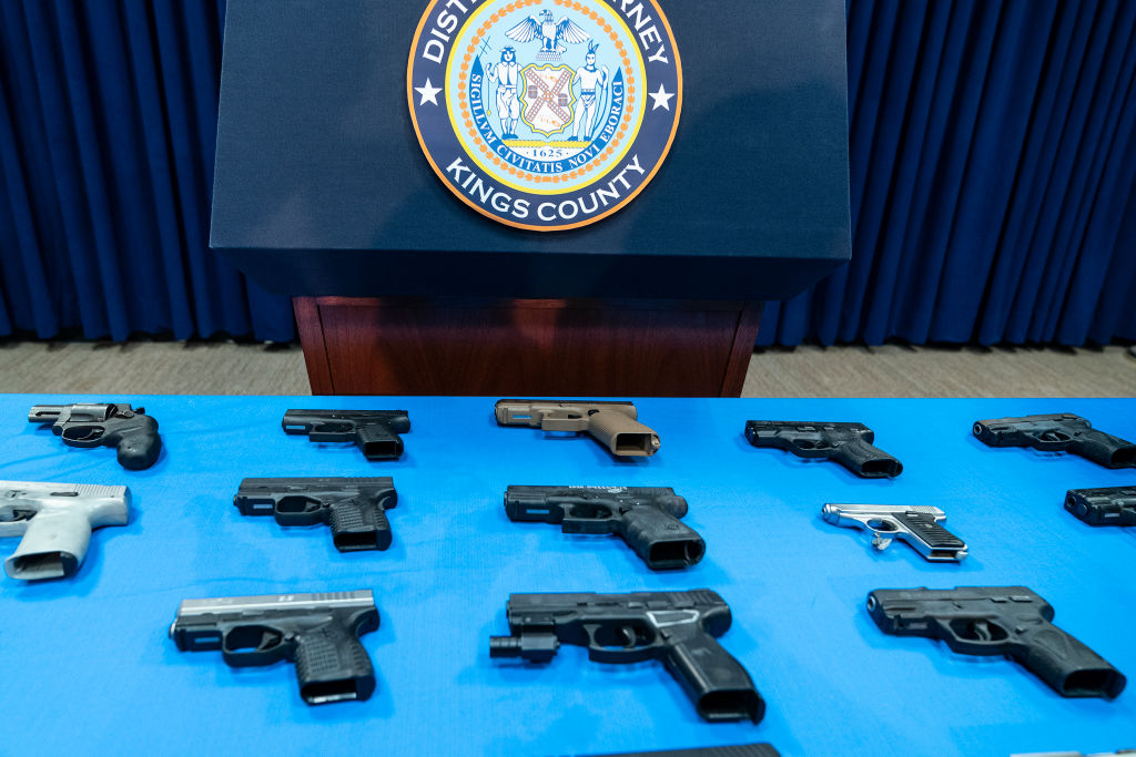 Guns confiscated from gang members on display during...