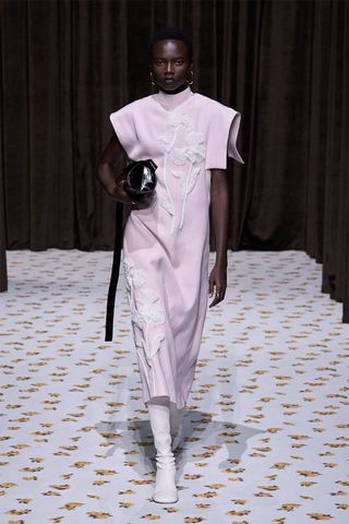 Spring/summer 2025 runway look featuring the powder pink color trend.