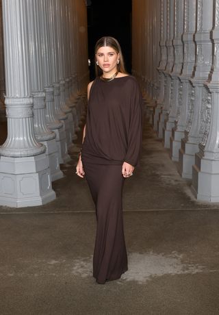 Sofia Richie Grainge wears a chocolate brown party dress.