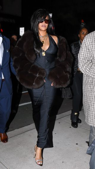 Rihanna wearing a brown fur coat