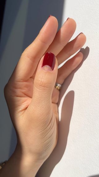 Burgundy nails with gold half moons