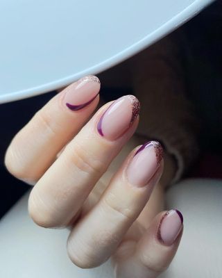 Gold and burgundy diagonal French tips