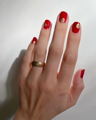 Red nails with circle nail art