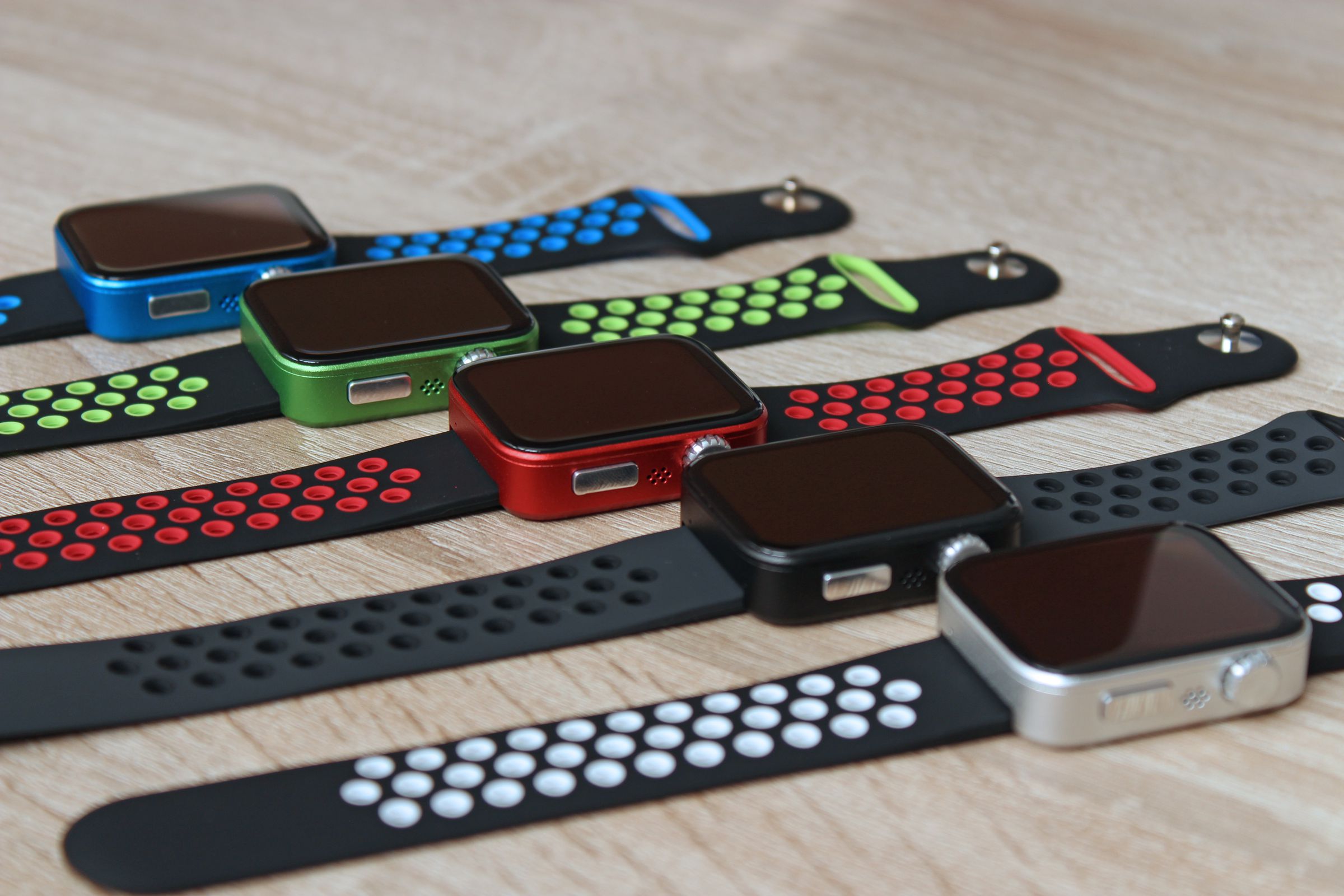 Five different Pocuter Spectra smartwatches in different colorways.