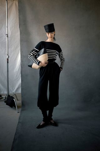 Altuzarra model wearing a statement-making hat.