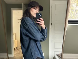 Woman wearing an Aritzia denim shirt.