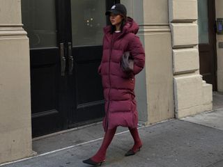 Fashion influencer @mimixn in New York City wearing a chic winter outfit styled with a puffer jacket.