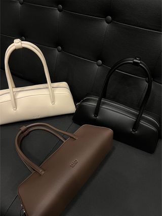 Freja's Mercer bag in three colors, cream, brown, and black.