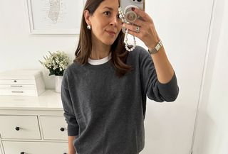 woman in gray crewneck sweater