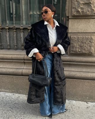 Nnenna Echem in a black faux fur coat