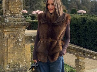 Emma Rose Leger in a faux fur vest at Estelle Manor