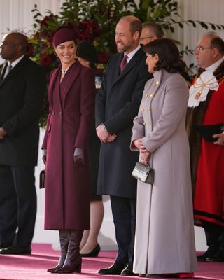 Kate Middleton wears a burgundy outfit