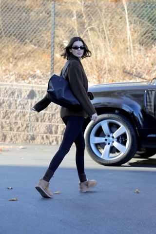 Kendall Jenner wears leggings and Uggs.