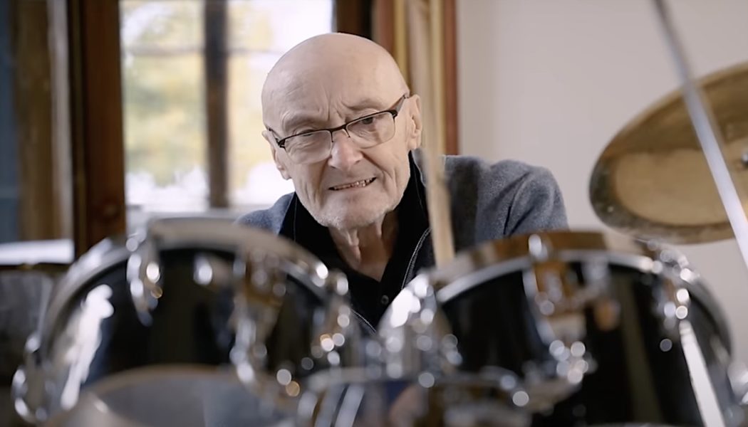 Phil Collins sits behind classic drum kit for first time in over a decade