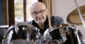 Phil Collins sits behind classic drum kit for first time in over a decade