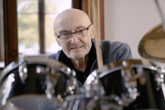 Phil Collins sits behind classic drum kit for first time in over a decade