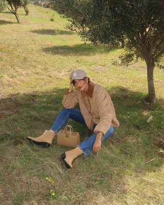 woman wearing barn jacket and jeans