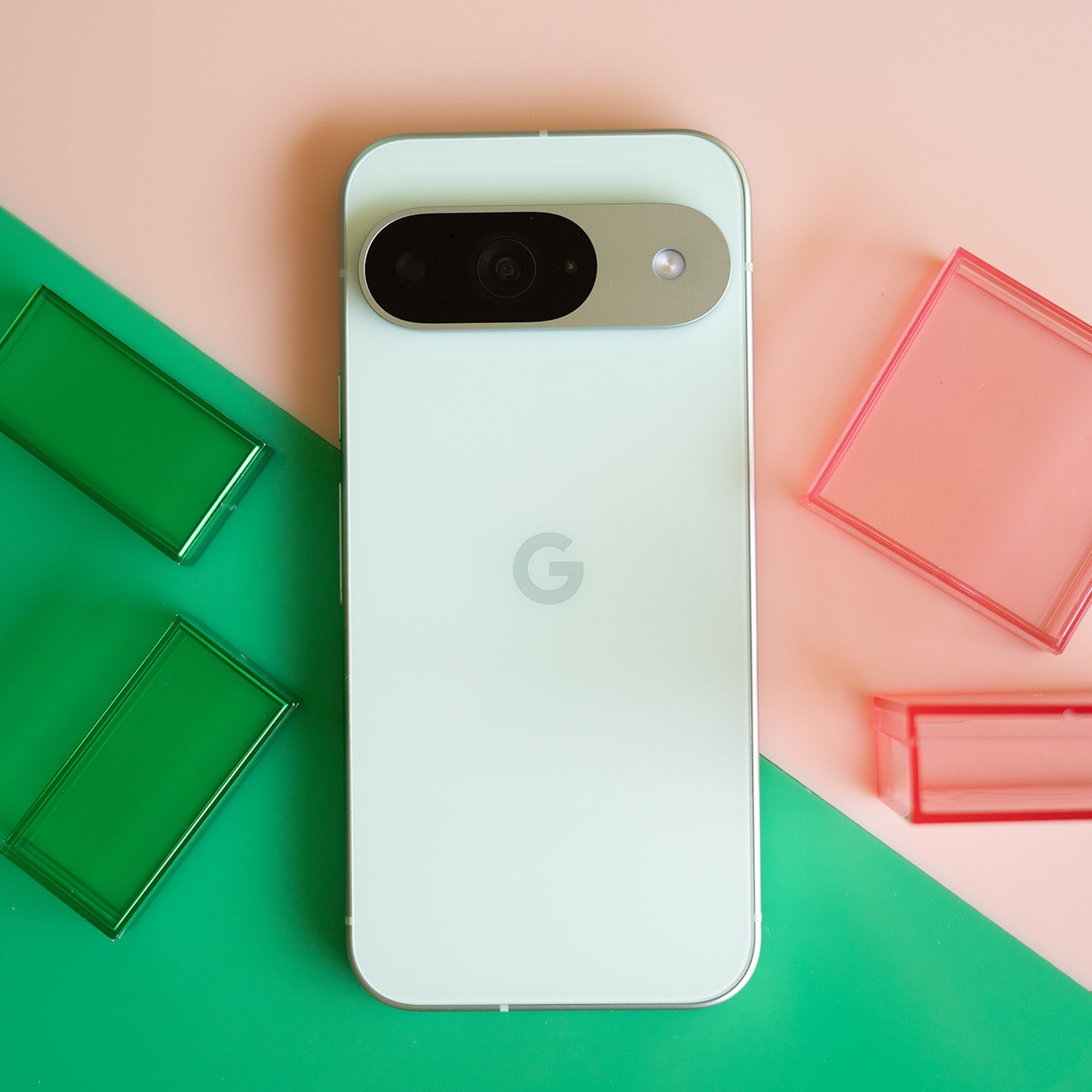 Google Pixel 9 on a pink and green background.