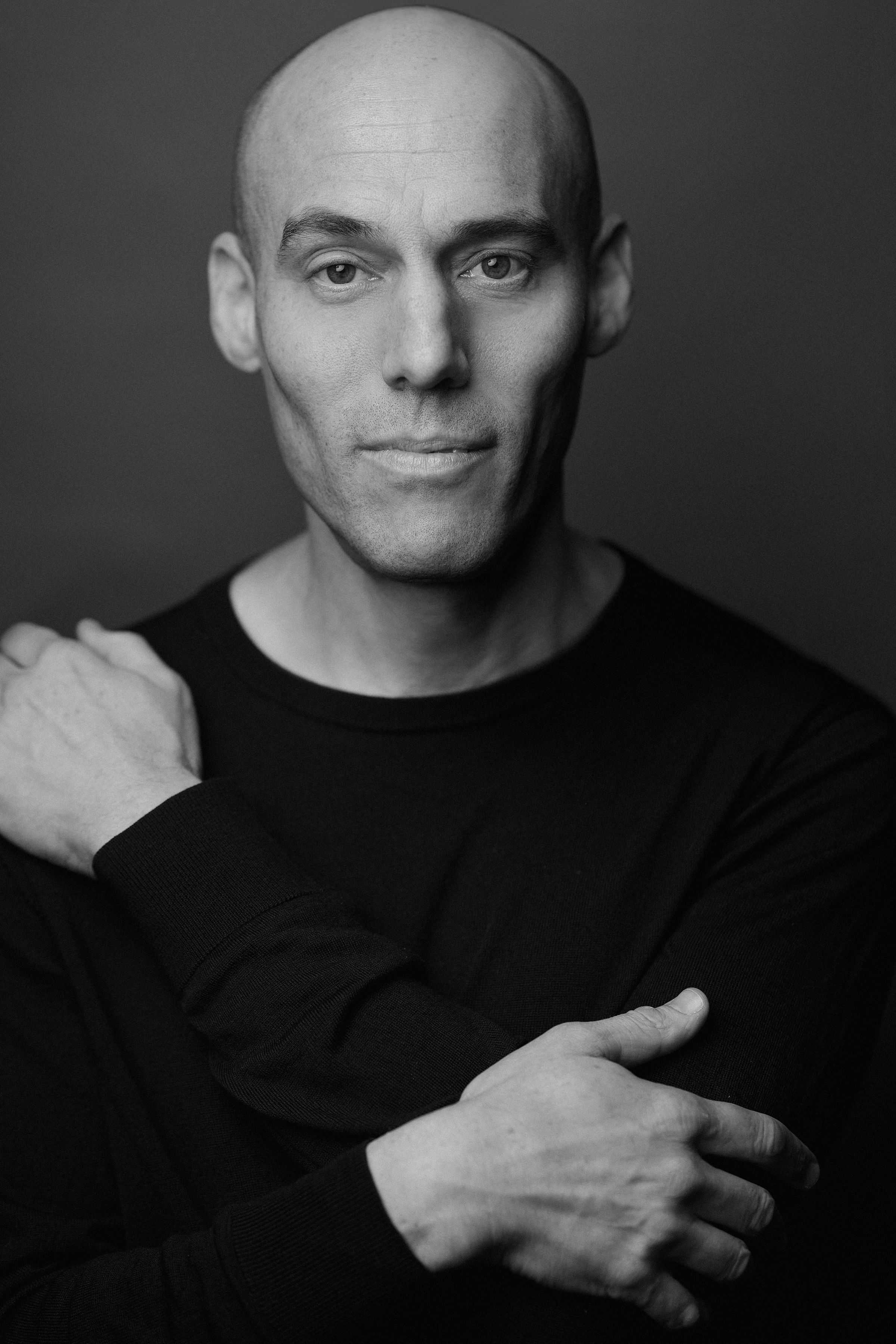 A headshot of director Joshua Openheimer