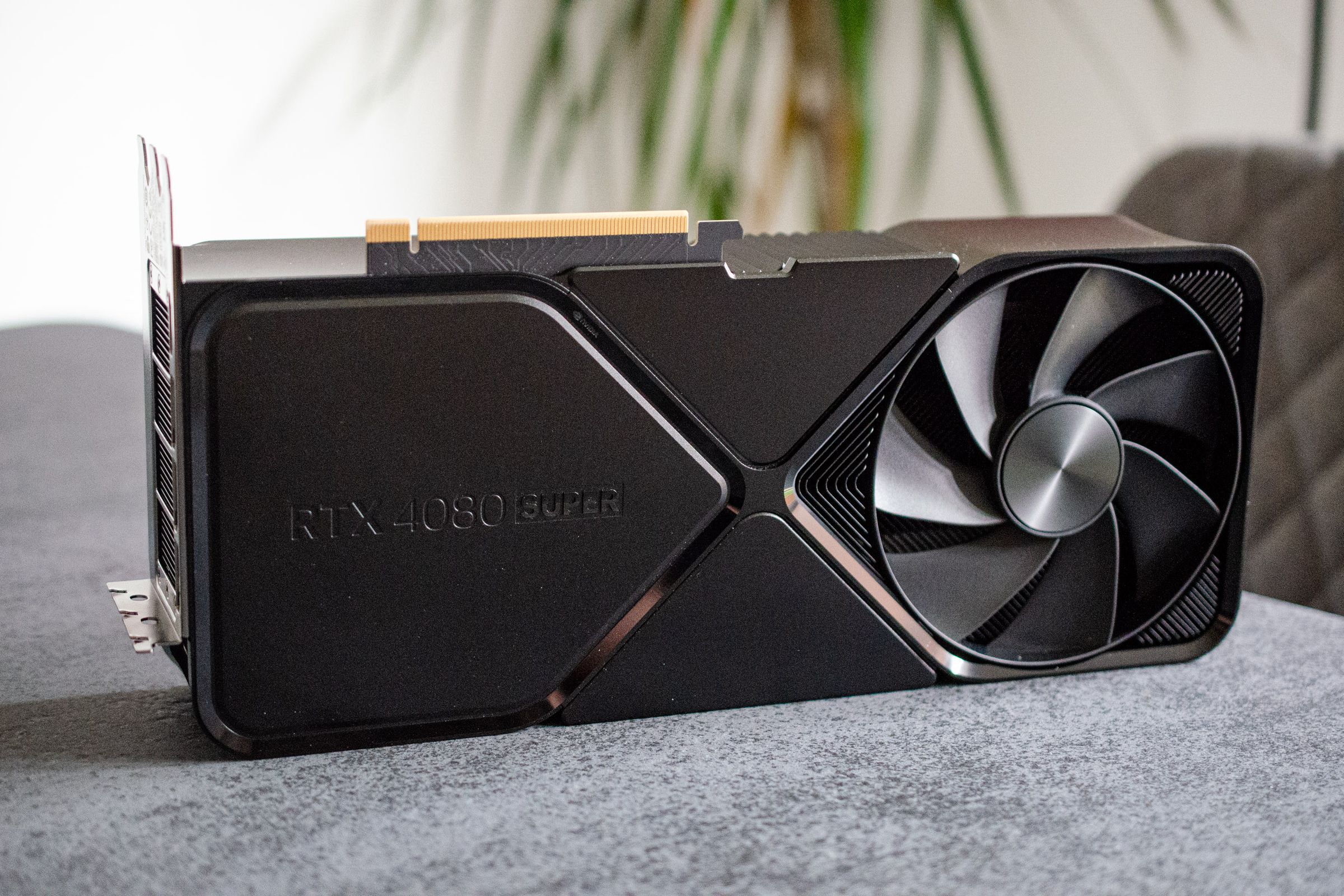 An RTX 4080 Super GPU sitting on a table