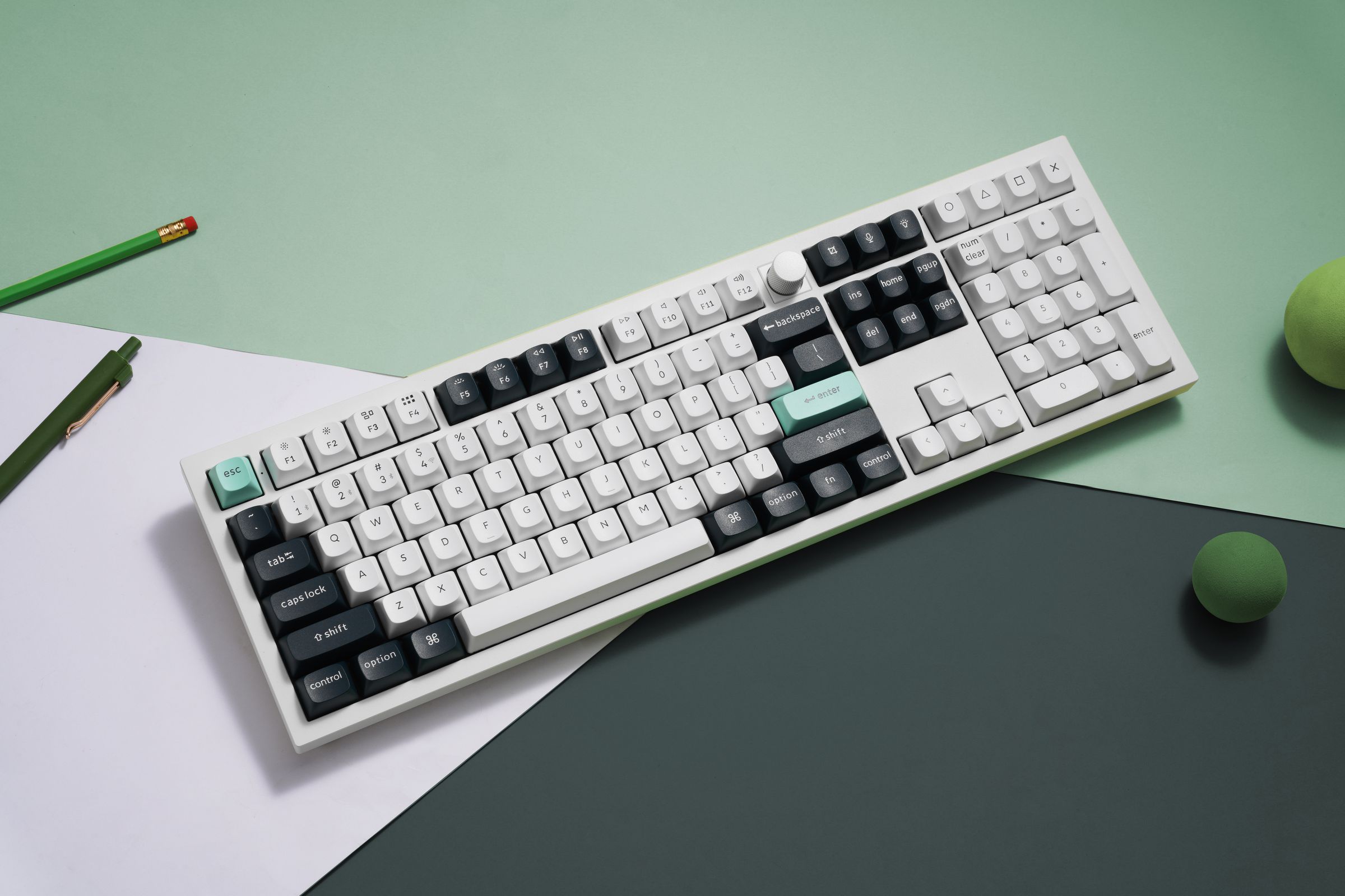 The Keychron Q6 HE&nbsp;in white against a green and white background.