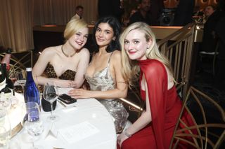 BEVERLY HILLS, CALIFORNIA - JANUARY 05: (L-R) Elle Fanning, Kylie Jenner and Dakota Fanning attend the 82nd Annual Golden Globe Awards at The Beverly Hilton on January 05, 2025 in Beverly Hills, California.