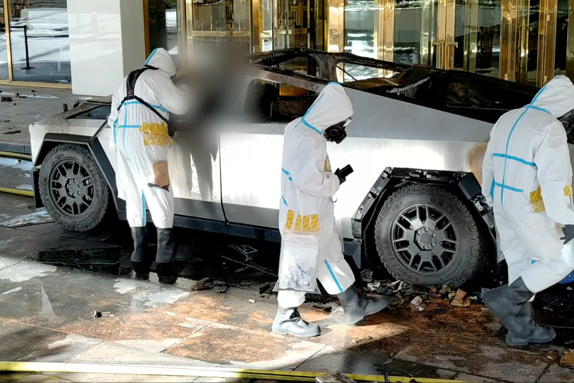 Screenshot of surveillance video, showing investigators with the Cybertruck after the explosion, as it sat in front of the Trump Hotel.