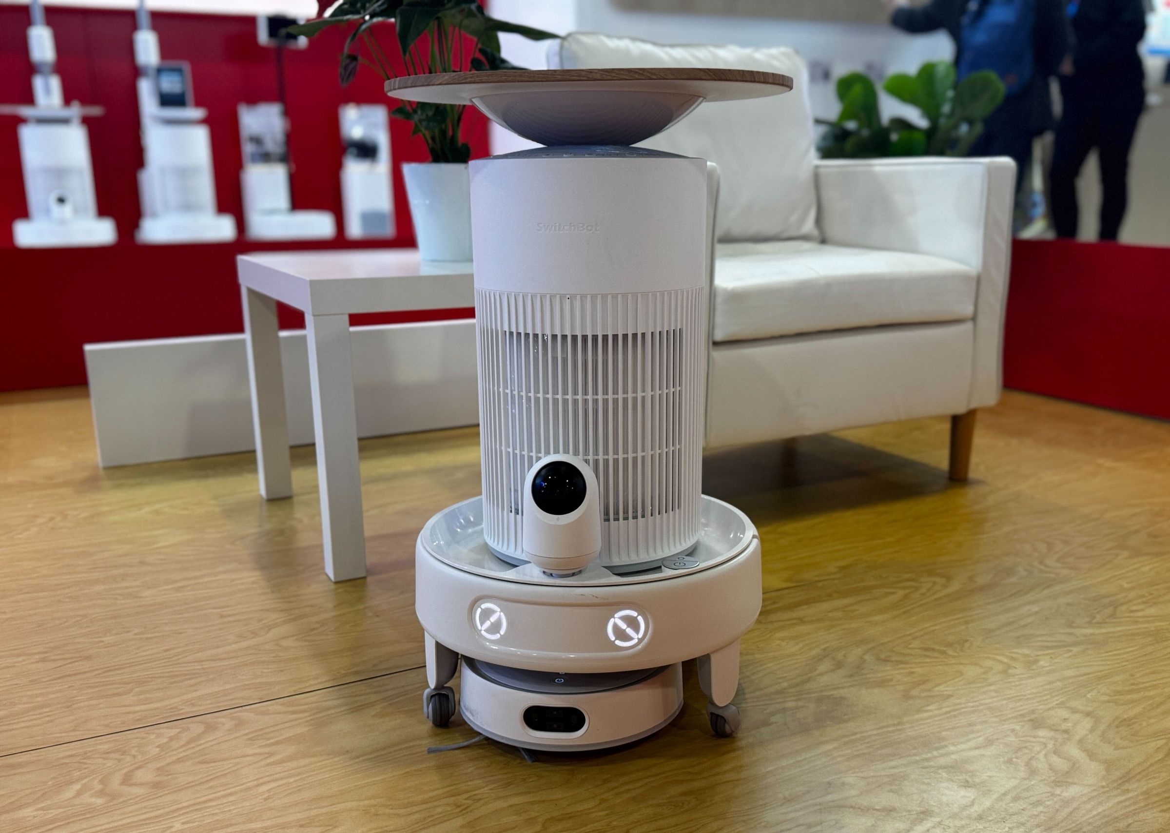 Switchbot’s K20 Plus Pro with a security camera and air purifier slash wireless charging platform.